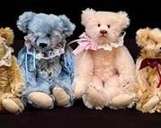 Collection of Four Friday's Bears measuring between 7-8.5" each