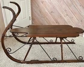 Lovely Antique Wooden and Metal Sleigh in very good vintage condition with some light wear including one chipped section on the bottom which is pictured.
Measures about 41” x 18” x 34.5”