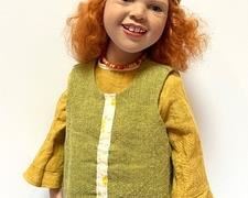 Zwergnase Doll by Nicole Marscholleck. Zwergnase Doll- Rosemyn. Beatutiful Rosemyn has the most captivating smile. She is dressed in an olive green linen overdress, with ruched detailing at the front , over a mustard colored underdress with matching head scarf. She has tow toned genuine leather shoes and colorful striped stockings. Rosemyn has beautiful wavy red human hair and brown glass eyes. s
Rosemyn is a hard to find doll by Zwergnase. She was limited to 250 worldwide.
Wonderfully detailed red headed doll measures 21"h