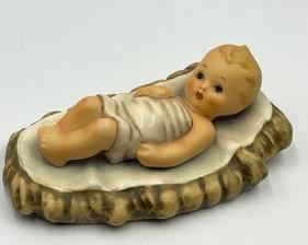Hummel Figurine Baby Jesus measuring 6" long and does have some crazing.