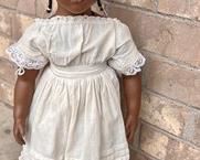 Annette Himstedt Sanga Doll featuring wonderful details; look at her gorgeous eyelashes!
Santa's dress does have some wear including some stains and some scuff marks on her body. She measures about 21"