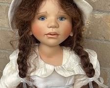 Artisan Doll by Berdine Creedy with braided brown hair and beautiful blue eyes. She measures about 28"