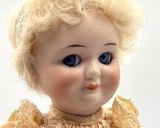 Vintage German Demalcol Googley Eyed Doll with beautiful blue set eyes, silk dress and crude body. Masuring about 9.75". She has some wear to her body, which can be seen in the photo gallery.
Marked Germany, Demalcol and 5/10 (which is the Demalcol maker's mark used from 1921-1926)