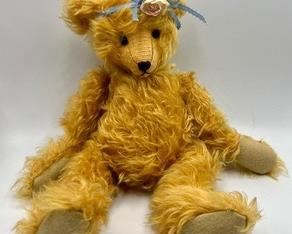 Adorable Artisan Bear by Joan Brown. Super cute jointed bear with an adorable face! Her mohair is intentionally distressed, giving her a slightly worn, loved look!
She measures about 12"