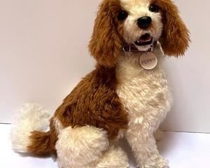 dorable Dog Figurine Named Poppy measures about 8” x 12”
