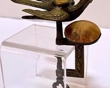 Antique Victorian Bird Shaped Sewing Clamp. What a cool find and wonderful collectible piece!
The bird has a spring to the interior of the tail which opens and closes the beak to hold the fabric in place. The screw clamp is functional.
Features a lovely floral design. The top of the bird would have had a pin cushion which is missing, There is wear to the existing pin cushion which can be seen in the photos.
Measures about 5" x 3.5" x 2"