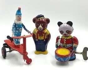 Three Vintage Wind Up Toys. The panda and clown wind up toys are in working order. The bear was not working. The tallest item in this grouping measures 5.5"