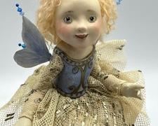 Friedericy Fairy Doll - a gorgeous wax over porcelain created masterpiece!
Measures 9" in the seated position. Three Vintage Wind Up Toys. The panda and clown wind up toys are in working order. The bear was not working. The tallest item in this grouping measures 5.5"