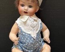 Adorable Vintage Heubach Koppelsdorf Doll. Features beautiful blue eyes and an open month. Measures 12" and has wear to the body including several chipped fingers
Marked 300, 610 and Germany on back.