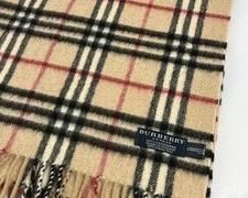 Burberry Scarf in very good condition. Measures 55" long.