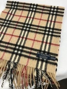Burberry Scarf in very good condition. Measures 55" long. 