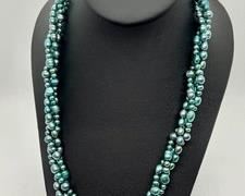Hues of Blue Dyed Freshwater Pearls
Measures 18" long and features a sterling clasp.