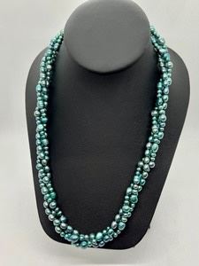 Hues of Blue Dyed Freshwater Pearls 

Measures 18" long and features a sterling clasp. 