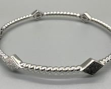 Sterling Silver Bangle Bracelet with Diamond Shaped Accents. Simple yet sensational!