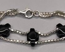 Sassy Sterling Silver Bracelet with 3 Sliding Black Onyx Beads measuring 7 inches long.
