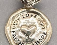 "Love Faith Hope" Sterling Silver Pendant measuring 1 1/8 inches in diameter. Great inspirational piece!