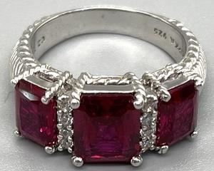 Judith Ripka Sterling Silver Ring with Synthetic Rubies that is a size 10.