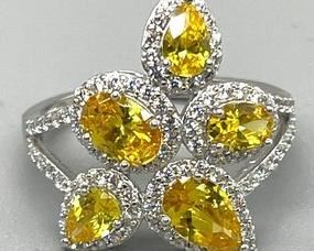 This ring just makes you smile! The yellow cubic zirconias are amazing! This JCL Sterling Silver Ring with Cubic Zirconia Stones is a size 10.