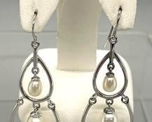 Sterling Silver and Freshwater Pearl Earrings that measure 2 inches long. Very classy and timeless!