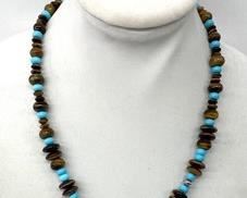 Sterling Silver Necklace with Tiger Eye Beads that measures 22-25 inches long.