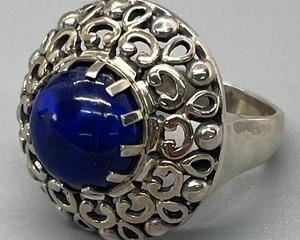 Sterling Silver Ring with Brilliant Cobalt Blue Center Lapis Stone in a size 10.