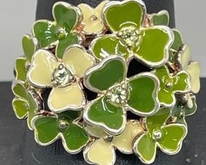 Sterling Silver Peridot Flower Clovers Shamrock Ring by designer SD Ireland
Here is the perfect ring for St. Patricks Day or everyday! This Sterling Silver Ring with Enamel Clover Accents is a size 10.
