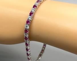 Pretty! Pretty! Pretty Pink! This Sterling Silver Bracelet with Cubic Zirconia Stones measures 7 inches long.