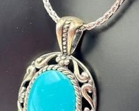 Carolyn Pollack Sterling and Turquoise Necklace. A lovely sterling and turquoise pendant designed by Pollack.
The chain measures 18". Looks to be in new condition.