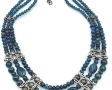 Carolyn Pollack Triple Strand Sterling and Apatite Beaded Necklace.
Apatite ranging from shades of teal to midnight. Measures 19" and about 1" wide.