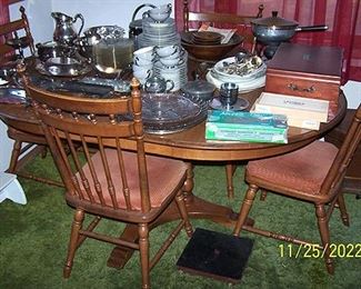 Dining table and chairs, assorted metal ware, Syracuse Debutante china (gray)