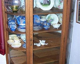 Curved glass china cabinet,  vintage Japan dishes, animals made from rock & wood