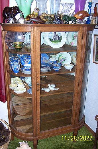 Curved glass china cabinet,  vintage Japan dishes, animals made from rock & wood