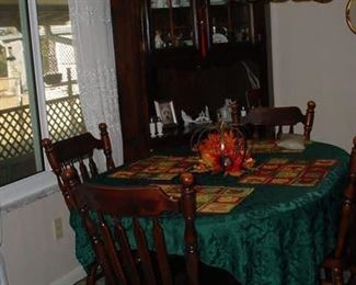 Dining room table with 4 chairs, and china cabinet