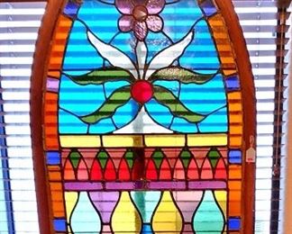 An arched church stained glass window