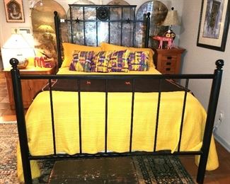 A custom Texas wrought iron queen bed with Temperpedic mattress