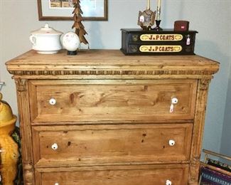A pine primitive chest of drawers with ceramic pulls