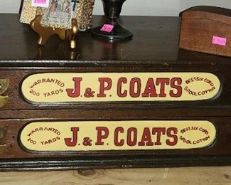An antique J & P Coats spool cabinet