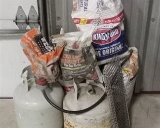 2 Propane Tanks, Bags of Charcoal, Ceramic Briquettes and Racks