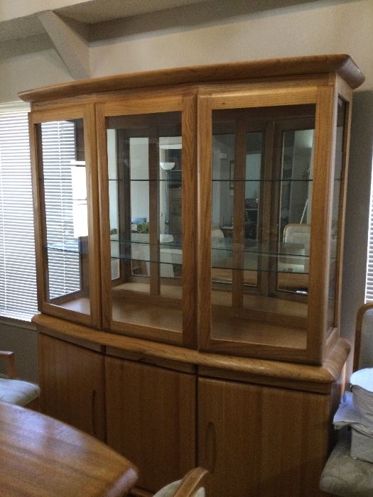 Beautiful Wambold China Cabinet. Dimensions: bottom,  64x 17x 32   Top: 46 x61 x 17. Lights in cabinets and electrical outlet in bottom cabinet. 