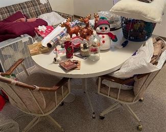 Dining table, holiday decor, fan, blankets, couch