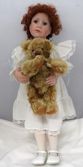 2709 - Doll holding teddy bear - 19", numbered on back
