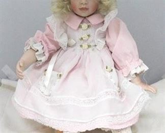 2715 - Hildegard Gunzel Porcelain doll on wood stand 14"
