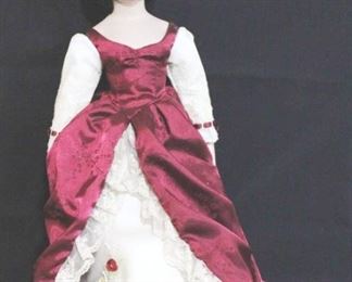 2915 - Heirloom porcelain doll on stand
