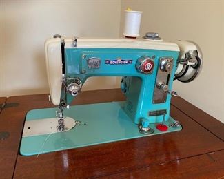 Vintage Sovereign Sewing Machine with Cabinet