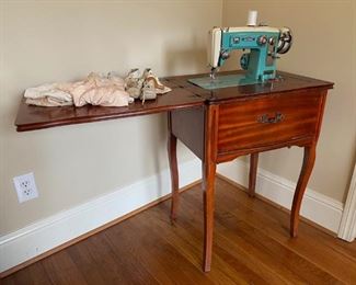 Vintage Sovereign Sewing Machine with Cabinet