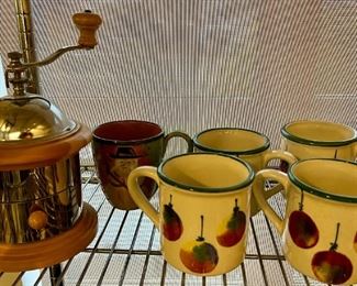 Starbucks grinder and assorted holiday mugs