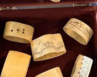 Inuit carved napkin rings and a pendant necklace that "wards off evil."