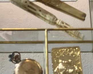 Pokemon card, pocket watch and pipes