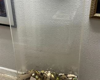 Large plexiglass case with random items in it