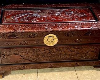 Small ornate wood trunk. One leg needs repairs but leg is with the tru k. 